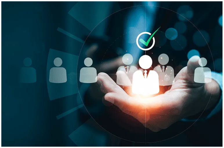 Hand holding glowing business person icon with green checkmark among transparent user icons in dark background.